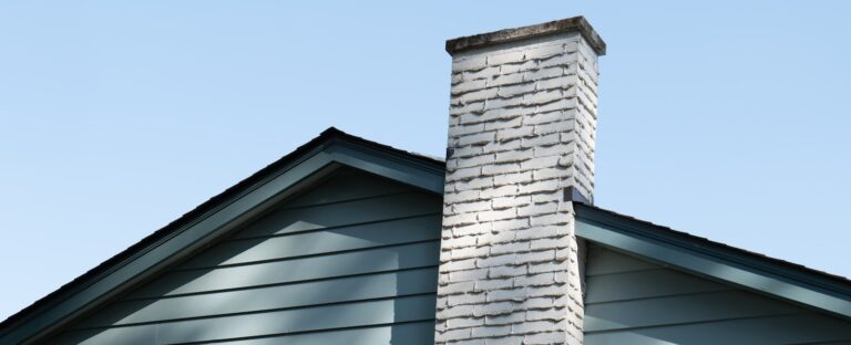 gray brick wall under blue sky during daytime